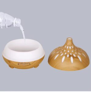 Yminigo 500ml wood grain aroma diffuser with water being poured into tank
