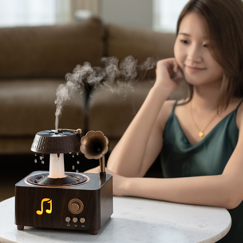 Yminigo V98 gramophone aroma diffuser with simulated raindrops on table