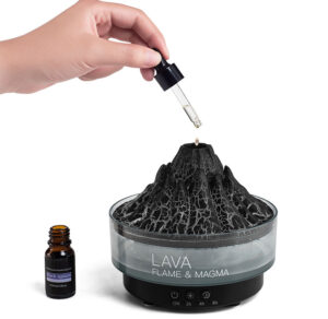 Adding essential oil with a dropper to the top of the Yminigo black volcano aroma diffuser