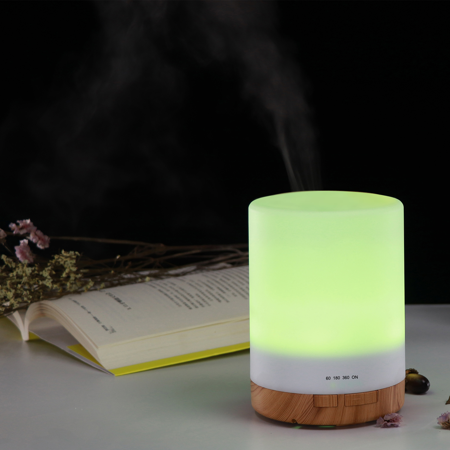 Yminigo wood grain aroma humidifier glowing green with timer settings for 60, 180, 360 minutes, and ON