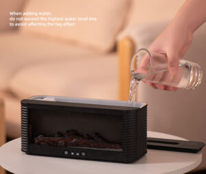 Pouring water into the 250ml tank of the Yminigo flame fireplace aroma diffuser