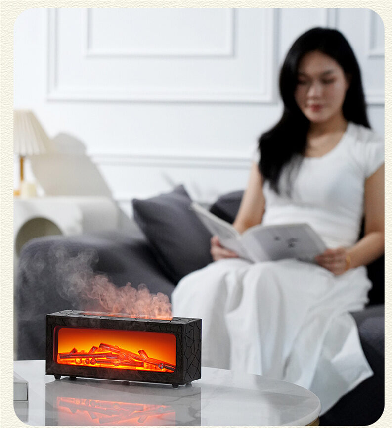 Yminigo Co6 flame humidifier on a coffee table while a woman reads on the sofa