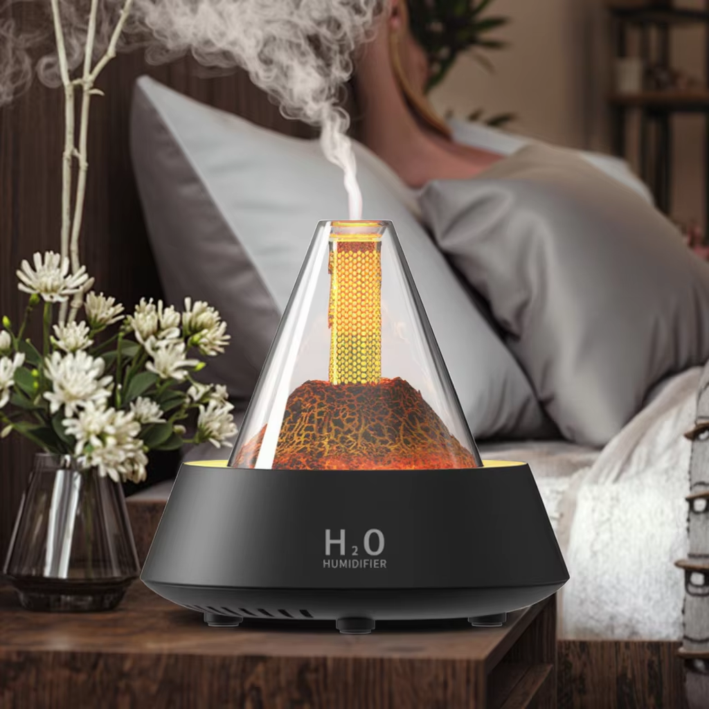 Yminigo black volcanic flame aroma humidifier emitting mist on a nightstand next to a sleeping person