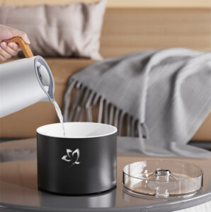 Yminigo C03 humidifier with a 160ml water capacity being filled